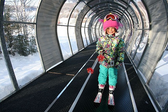 Sir Sam's covered ski lift protects young skiers from the elements