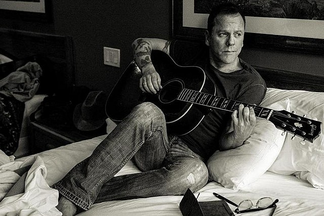 Actor Kiefer Sutherland performs on June 29th as he tours in support of his 11-track debut album "Down in a Hole", which Rolling Stone describes as "folk-tinged" (photo: Beth Elliott)