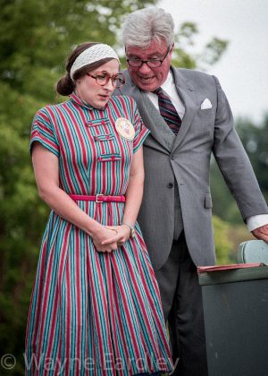 Kait Dueck makes her 4th Line acting debut as bank teller Jean Kennedy, with Rob Fortin as George Milliken (photo: Wayne Eardley, Brookside Studio)