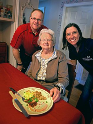 Neil and Emily Ogilvie of Heart to Home Meals with Emily's grandmother (supplied photo)