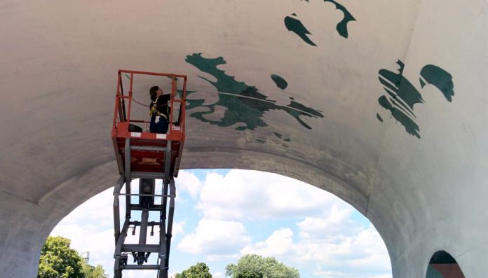 It's not visible in the photo, but the entire mural has been sketched in pencil on the archway. (Photo: Bruce Head / kawarthaNOW)