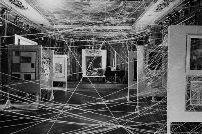 An image of an installation involving a lot of twine by Marcel Duchamp, for the exhibition "First Papers of Surrealism", 1942. Duchamp is considered one of the forerunners in installation art (photo: John Schiff, courtesy Philadelphia Museum of Art / Art Resource, NY)