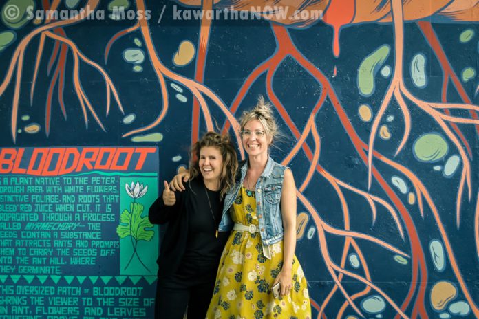 Artist Jill Stanton with fellow artist Kirsten McCrea, who completed the adjacent "Electric City" mural last year (photo: Samantha Moss / kawarthaNOW.com)