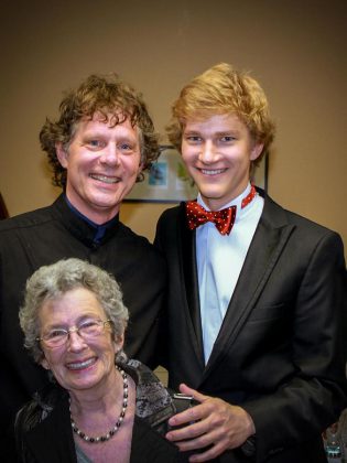 Erica Cherney with Maestro Michael Newnham (standing left) and classical pianist Jan Lisiecki (standing right) after a PSO concert in June 2015