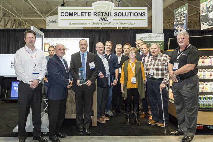 Complete Retail Solutions Inc. accepting a best of show award at the Grocery Innovations Canada trade show (supplied photo)