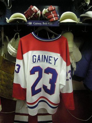 Bob Gainey's hockey sweater hangs in the replica Montreal Canadiens locker room at the Hockey Hall of Fame in Toronto. Bob will wear one of his jerseys at A Nutcracker Christmas, before it's signed and raffled off in support of the PSO. (Photo: Michael Barera)