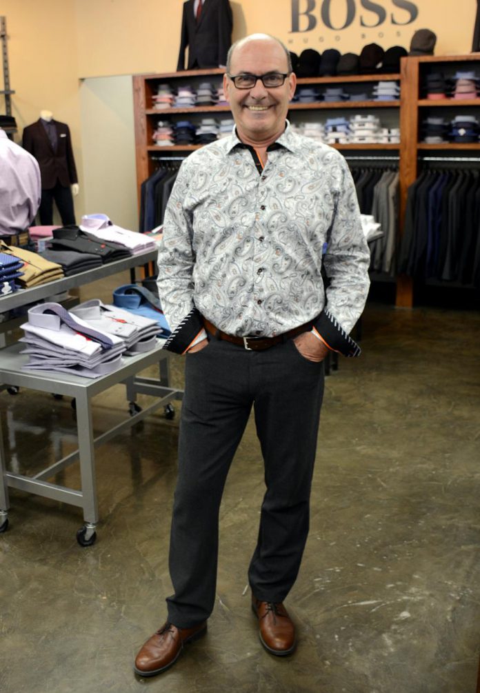 John wears an Au Noir shirt with Alberto Ceramica pants and a Hugo Boss belt. It's easy to make it casual for the evening: "When I go home I'll throw on a pair of jeans, untuck it and go out." (Photo: Eva Fisher)