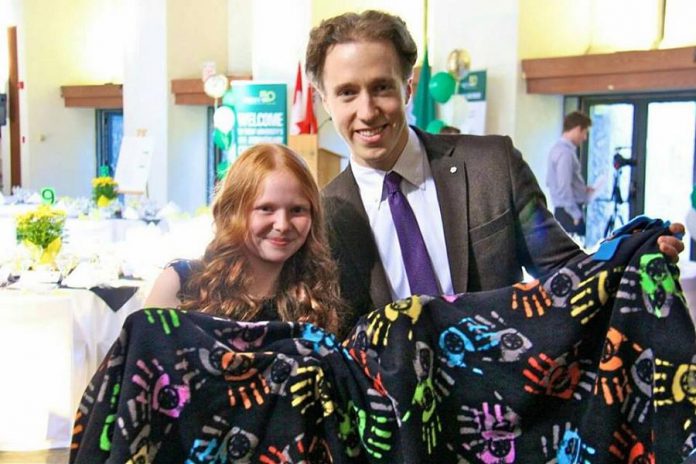 Faith Dickinson in 2015 with Craig Kielberger, a Canadian activist for the rights of children and co-founder of the ME to WE Awards. Faith won the 2015 ME to WE ME to WE Youth In Action Award.  (Photo: Cuddles for Cancer / Facebook)