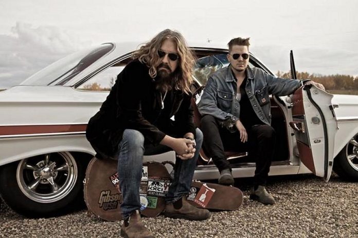 Tom Wilson and his son Thompson, along with drummer Ray Farrugia and pedal steel player Aaron Goldstein, perform as Lee Harvey Osmond at Peterborough's Market Hall on January 19 (publicity photo)