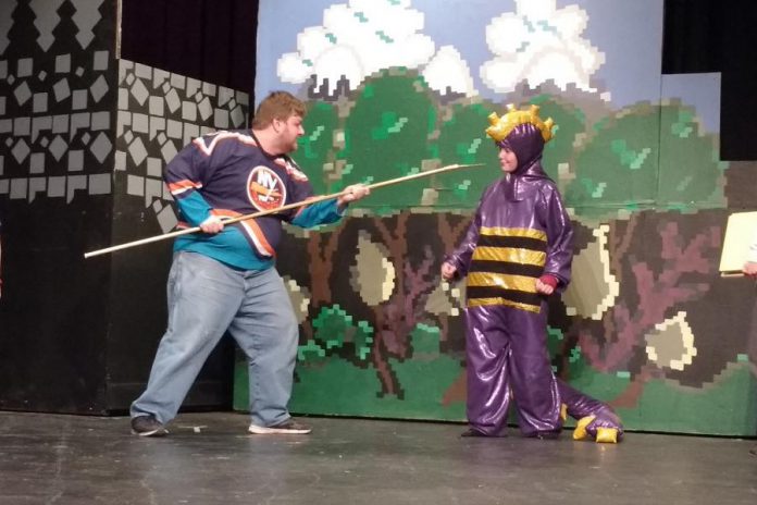 Josh Butcher as Saint George the Dragon Slayer, one of only three adult actors in the play, faces off against Samuelle Weatherdon as Mortimer during a dress rehearsal (photo: Sam Tweedle / kawarthaNOW)