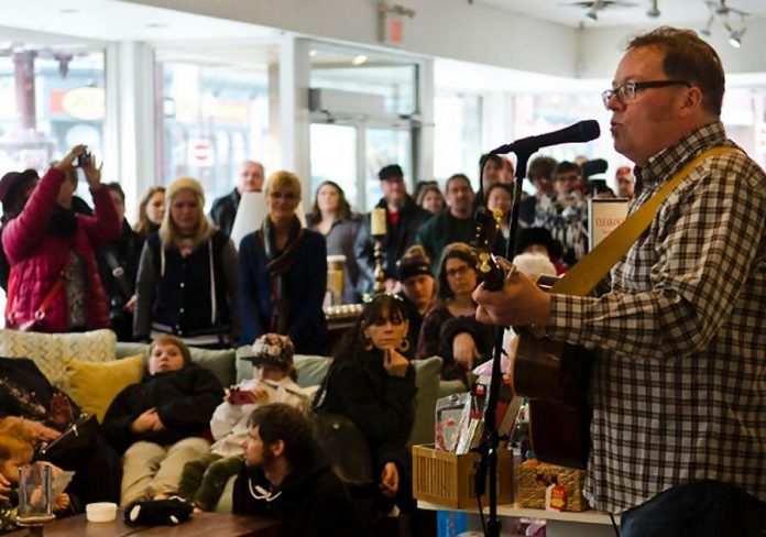 Rick Fines performing at a pop-up concert during the family friendly February Folk Folly in 2016 (photo: Peterborough Folk Festival)