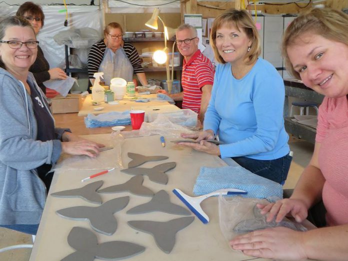 Some of the volunteers at the Kawartha Potters Guild who have created 600 ceramic trilliums for the Peterborough War Memorial (photo: Kawartha Potters Guild)