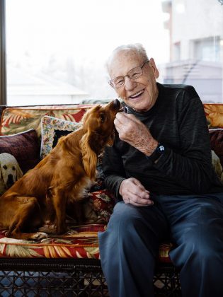 Former NHL goaltender Johnny Bower enjoying a moment with Jasper, a Cocker Spaniel rescue dog adopted by photographer Peter Nguyen, during a photo shoot for the Peterborough Humane Society's Shelter Shots 2018 calendar (photo: Peter Nguyen)