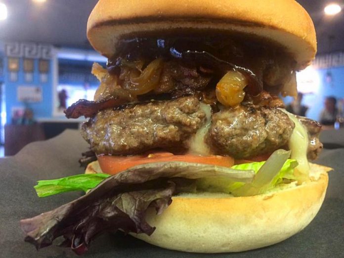 One reason why Canadian Living readers named Olympus Burger the best place in Canada to get a burger: the Ares is a peppercorn beef patty with crispy bacon, caramelized onion, sautéed mushrooms and Olympus BBQ sauce. (Photo: Olympus Burger / Facebook)