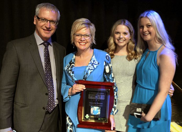 Rhonda Barnet, pictured here with her family, wants to encourage young women to pursue a career in manufacturing. (Photo: Eva Fisher / kawarthaNOW.com)