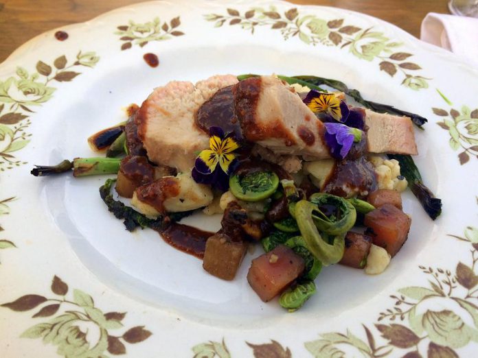 Guests of the Flower Moon Supper were treated to maple wild leek pork with sumac jus, spatzle, spring onions and fresh fiddleheads. (Photo: Eva Fisher / kawarthaNOW)