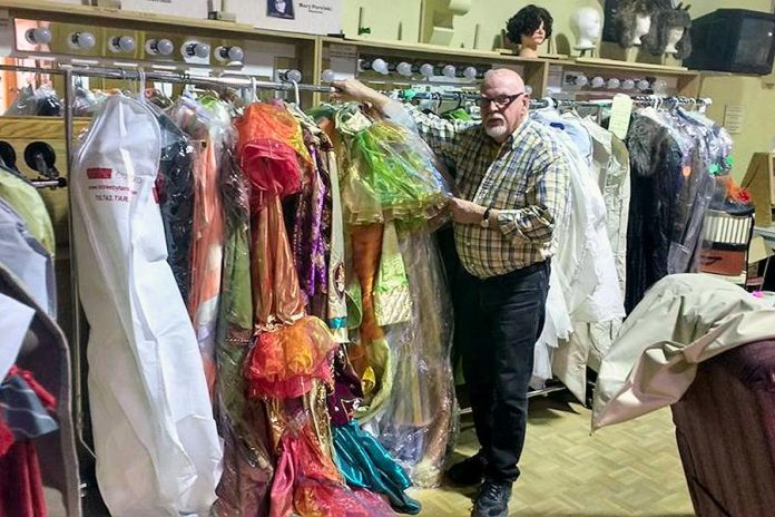 Howard Berry with some of the many costumes he has designed for the Peterborough Theatre Guild. (Photo: Sam Tweedle / kawarthaNOW)
