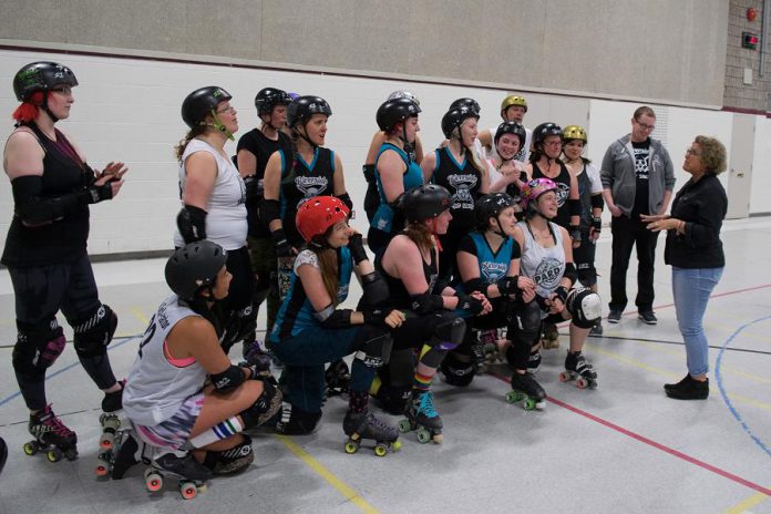 Manager of Development and Outreach at the Peterborough Humane Society Susan Dunkley (right) speaks with some of PARD skaters during a recent practice. (Photo: Scott Tromley)