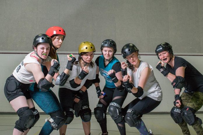 PARD members hamming it up for the camera at a recent practice. It's a full-contact sport, so skaters wear helmets, elbow pads, wrist guards, knee pads, and mouth guards.  (Photo: Scott Tromley)