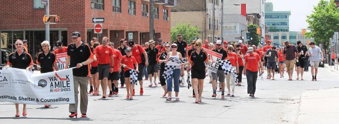 During the annual fundraiser for YWCA Crossroads Shelter, hundreds of people don red high heels and "walk a mile" through downtown Peterborough. (Photo: Peterborough DBIA)