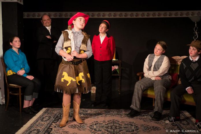 Emily Keller takes centre stage as Cowpoke as the cast of Boy Wonders listen to her origin story. (Photo: Andy Carroll)