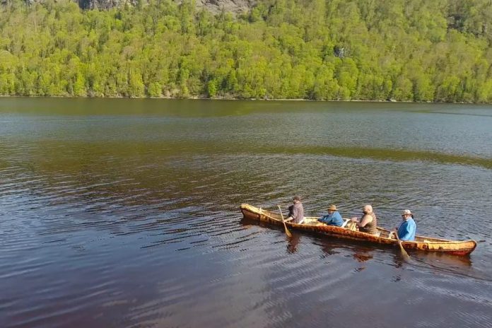 Members of Miawpukek First Nation paddling the canoe, described with the Mi'kmaq word "gwitna'q", which means "go by canoe".  (Photo: Miawpukek First Nation)