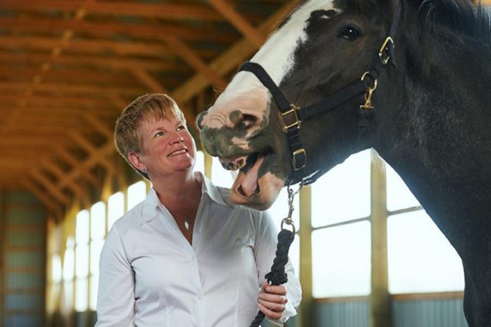 The Mane Intent owner and program director Jennifer Garland with Raven, one of her horses. (Photo: Brian Summers)