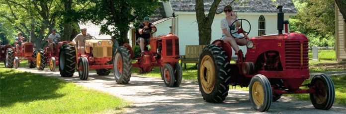 The annual Father's Day Smoke & Steam Show at Lang Pioneer Village includes a tractor parade through the village.