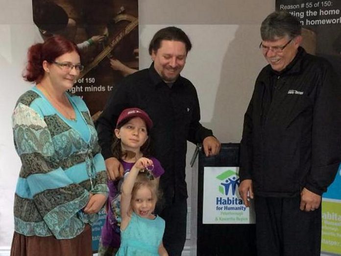 Joshua and Natasha Clark-Bandi and their daughters Autumn and Jasmine received the keys to their new home on Tuesday, June 27 at the Habitat Home Dedication Ceremony at 887 Peterborough Street in Warsaw.