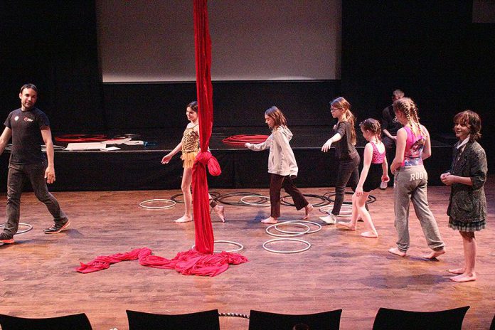 Thomas Vaccaro, creative director for Peterborough Academy of Circus Arts, trains children on an apparatus in the Circus Extravaganza Camp. (Photo: Market Hall Performing Arts Centre)