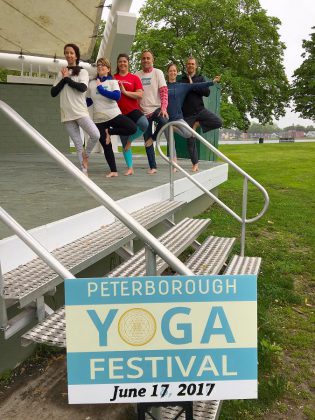 Peterborough Yoga Festival organizers and representatives from United Way Peterborough and District at a media event for the festival at Del Crary Park on June 6. (Photo: United Way Peterborough and District).