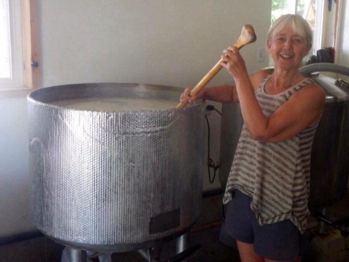 At Belmont Lake Brewery they stir the barley into their Cordova Gold with a paddle. (Photo: Belmont Lake Brewery)