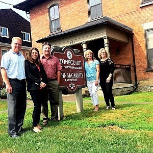Ben Shaunghnessy, Sheri Dietrich, Tom Bennett, Kendra Buckton, and Cathy Burningham outside the Stoneguide Realty office at 343 Stewart Street in Peterborough