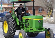 Peterborough MP Dean Del Mastro drives a tractor when announcing plans for a tractor parade to open the 2013 Peterborough Exhibition (photo: deandelmastro.ca)