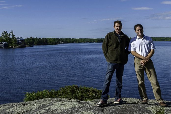 Ben Sämann, General Manager of Viamede Resort, and Mike Hendren, Executive Director of Kawartha Land Trust, take in the natural beauty of Stoney Lake, where the Peterborough Symphony Orchestra will perform an open-air concert on Sunday, August 17