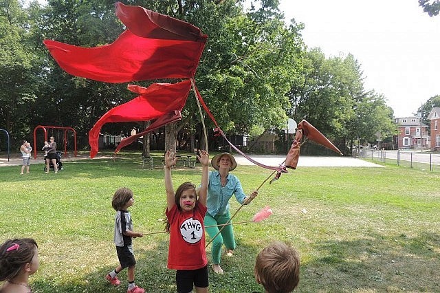 Atelier Ludmila's Laurel Paluck and some friends take the Giant Fire Bird out for a test flight at the park on Stewart Street (photo: T. Wilson)