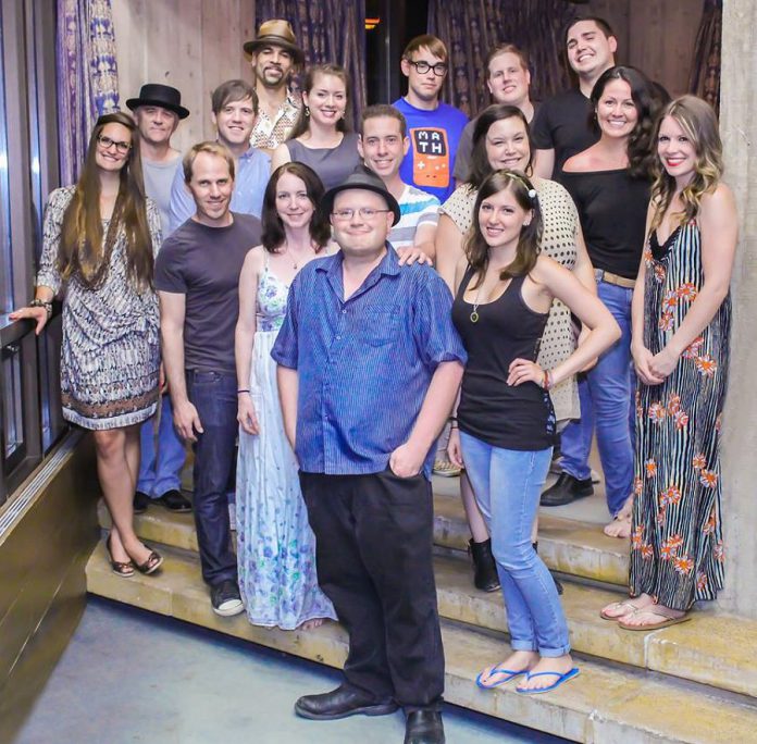 The Purple City Chorus (left to right: Chelsey Bennett, Rob Phillips, Kevin Sieana, Matt Crowley, Beau Dixon, Grainne Ryan, Carling Stephen, producer Sam Tweedle, Jeffrey Danger, Bloody Boy Blue, Scarlett Grace, Meg O'Sullivan, Kent Randall, Andrew Curtis, Missy Knott, Kate Suhr)