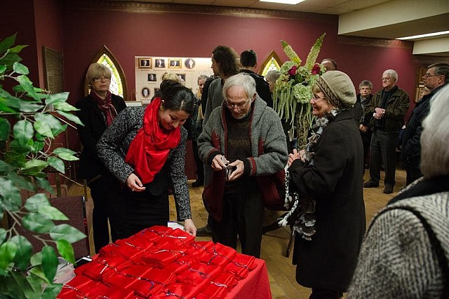 Maryam Monsef of The Red Pashmina Campaign selling scarves in the lobby in support of the campaign and the Peterborough Theatre Guild 