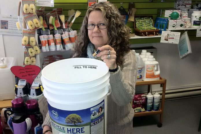 You can drop your old household batteries for free at the Peterborough GreenUp Store, as demonstrated by store manager Ausma Clappison. They'll be sent away for safe disposal and recycling, keeping them out of the landfill. (Photo courtesy of Peterborough GreenUp)