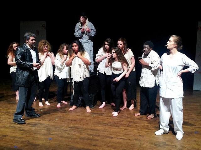 Sweeney Todd (Lucas DeLuca) confronts rival barber Adolfo Pirelli (Christina Pidgeon) as sreet urchin Toby (Taylor Beatty) and the chorus look on (photo: Sam Tweedle / kawarthaNOW)