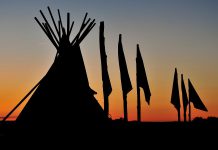 Photographs by Georgie Horton-Baptiste and George Campana are on display at two locations this month during the SPARK Photo Festival, like this tipi with flag poles at Pine Ridge Reservation in South Dakota (photo: George Campana)