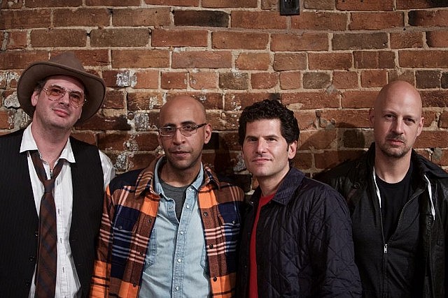 Ken Tizzard with the other members of The Watchmen: singer Danny Greaves, drummer Sammy Kohn, and guitarist Joey Serlin (publicity photo)