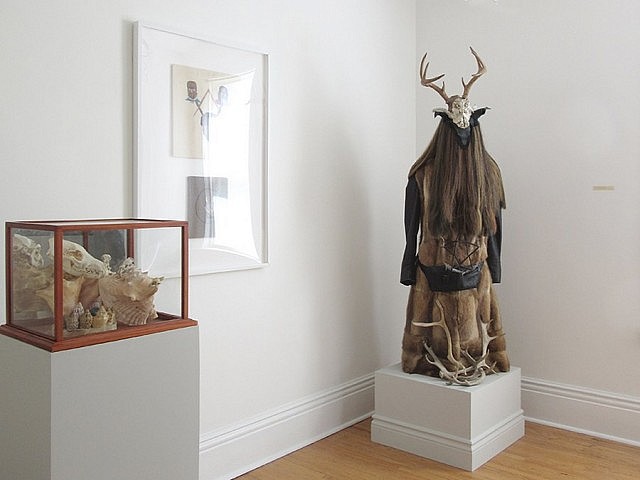 I believe that is a dog skull in the display case, and the Neolithic-looking figure in the corner has just enough contemporary flair to prick the imagination (photo courtesy of Paulo Fortin at Evans Contemporary)