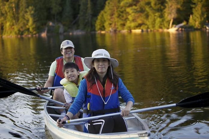 Paddling on a lake is a great way to spend time with family, and research shows that exercise in nature has a more positive effect on blood pressure and mood than exercise in a gym (photo: Ontario Parks)