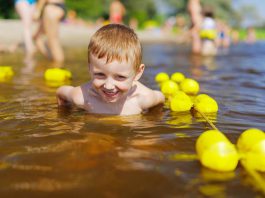 Young boy swimming in the water