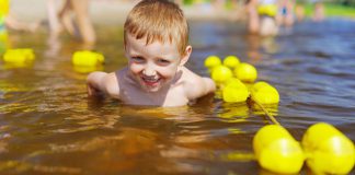 Young boy swimming in the water