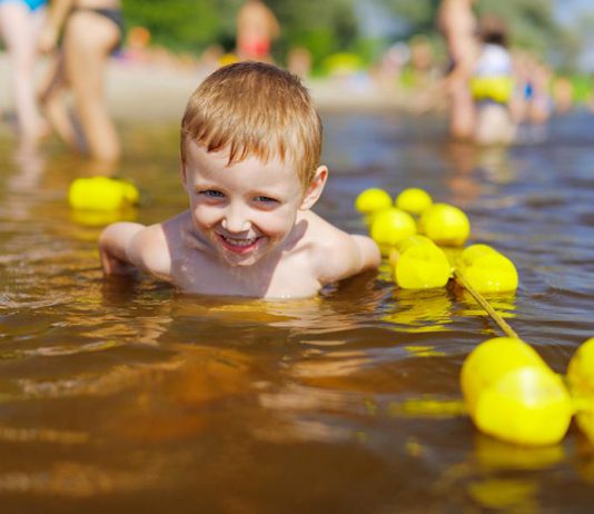 Young boy swimming in the water