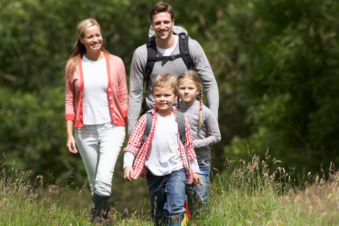 Ticks settle on tall grasses and bushes and attach themselves to passing people or animals. When hiking, wear long pants and long-sleeved shirts and tuck your pants into your socks, especially when walking in long grass.