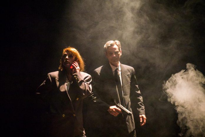 Sarah McNeilly and Ryan Kerr star as FBI agents Fox Mulder and Dr. Dana Scully in The Theatre on King's stage recreation of "The X-Files" (photo: Andy Carroll / TTOK)