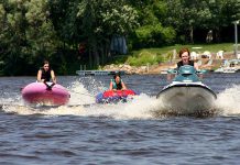 This looks like a lot of fun, but it's actually unsafe — and illegal. When towing, you must have a "spotter" and sufficient seats on the watercraft to carry each person being towed. (Photo: Wikipedia)